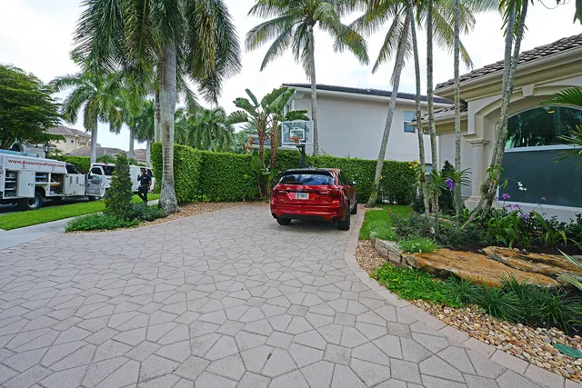 a front view of a house with a garden