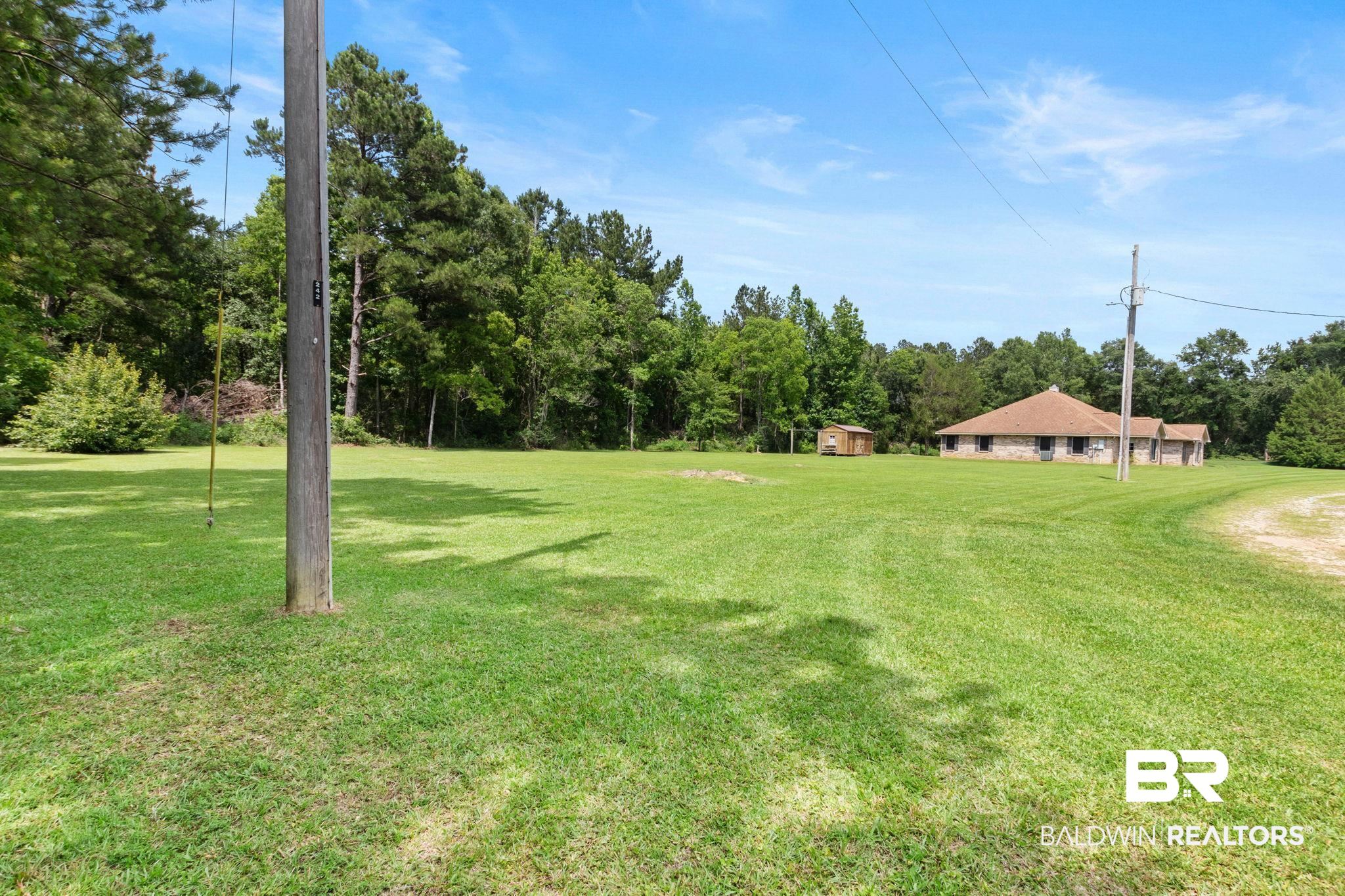 16151 Tolbert Road Bay Minette, AL 36507 - Photo 62 of 74 Expansive green lawn providing a substantial outdoor area