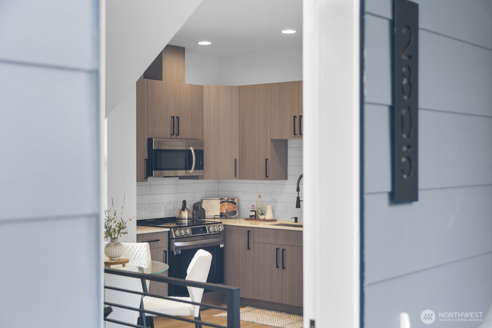 a kitchen with a sink cabinets and window