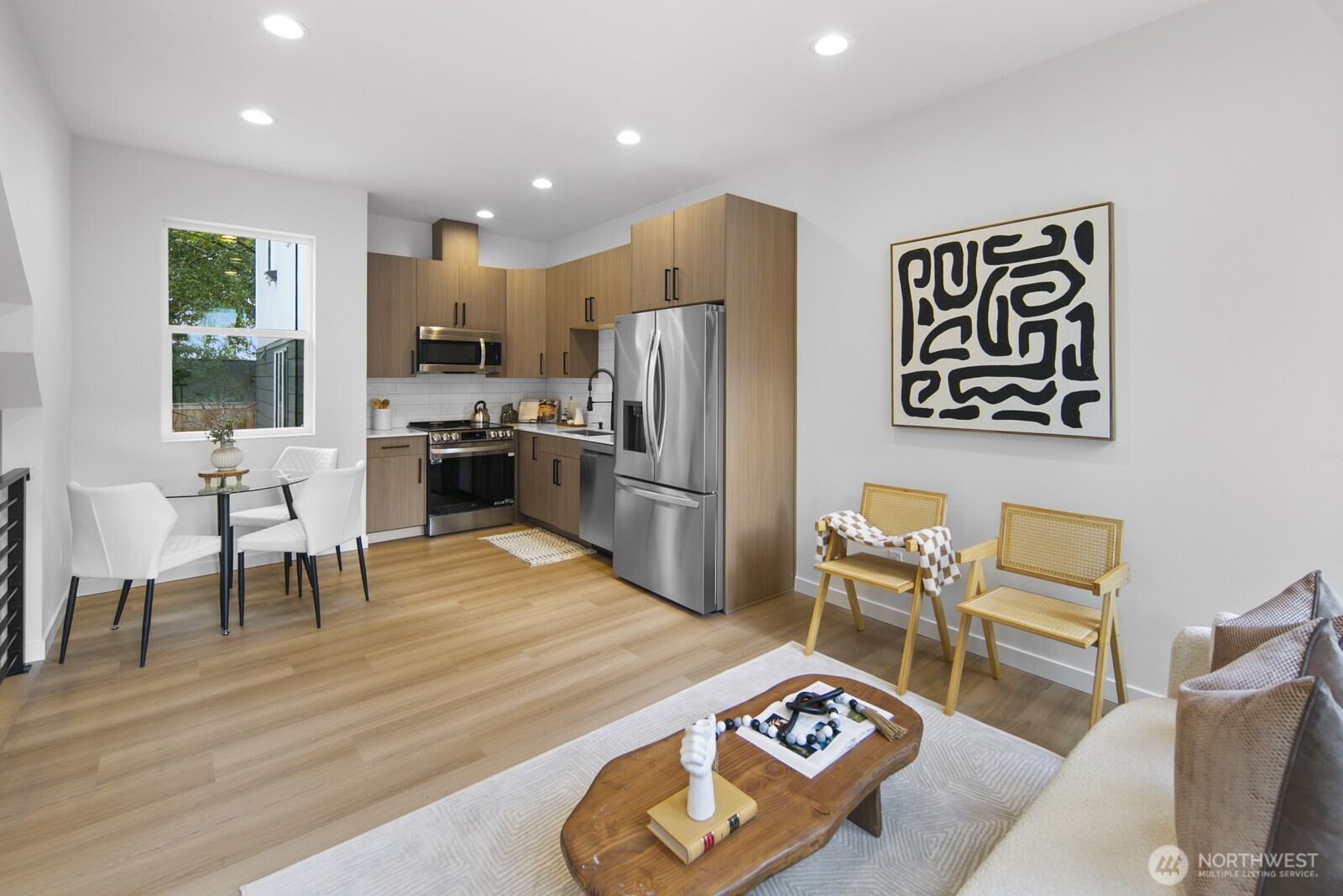 2805 South Grand Street Seattle, WA 98144 - Photo 2 of 31 a kitchen with stainless steel appliances granite countertop a refrigerator and a dining table