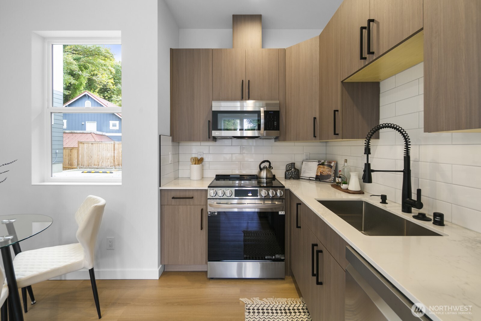2805 South Grand Street Seattle, WA 98144 - Photo 8 of 31 a kitchen with a sink cabinets and window