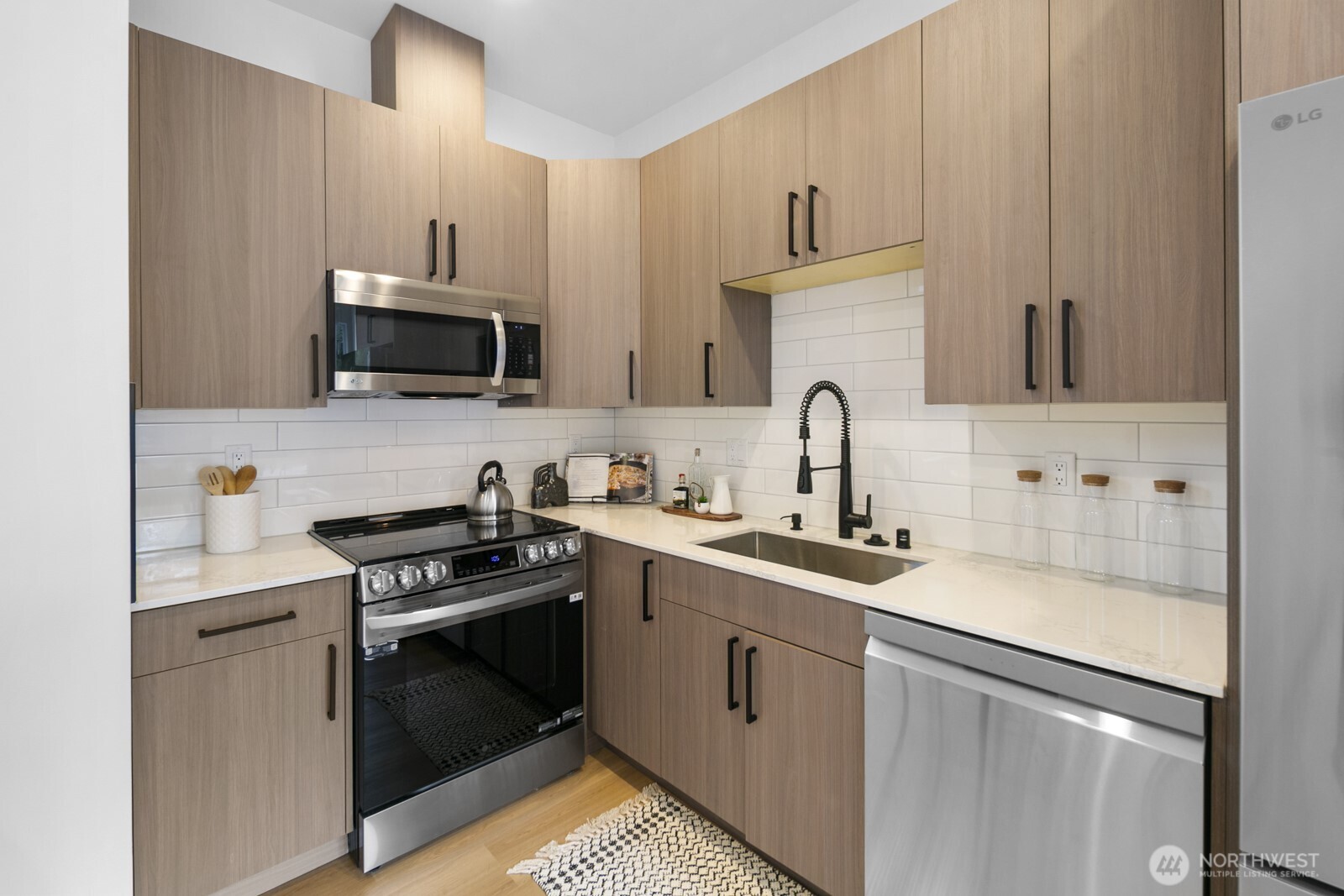 2805 South Grand Street Seattle, WA 98144 - Photo 9 of 31 a kitchen with cabinets stainless steel appliances and sink