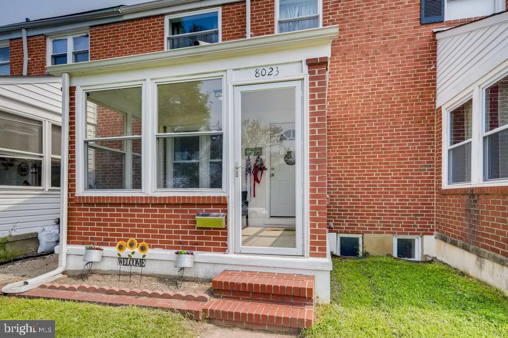 8023 Wallace Road Baltimore, MD 21222 - Photo 1 of 21 a view of brick building with a yard
