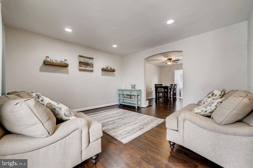 8023 Wallace Road Baltimore, MD 21222 - Photo 20 of 21 a living room with furniture and wooden floor
