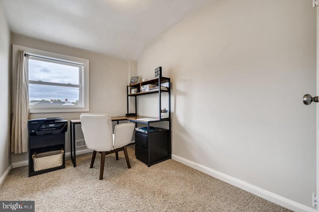 8023 Wallace Road Baltimore, MD 21222 - Photo 10 of 21 a workspace with furniture and window