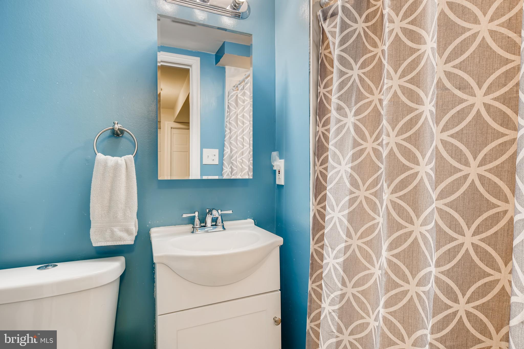8023 Wallace Road Baltimore, MD 21222 - Photo 15 of 21 a bathroom with a sink and a mirror