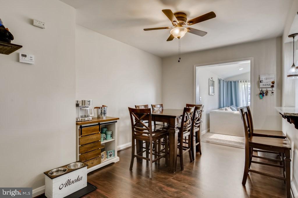 8023 Wallace Road Baltimore, MD 21222 - Photo 2 of 21 a view of a dining room with furniture and wooden floor