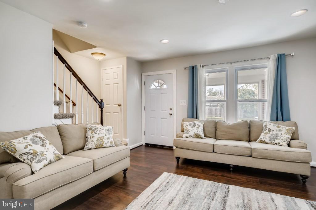 8023 Wallace Road Baltimore, MD 21222 - Photo 5 of 21 a living room with furniture and a large window