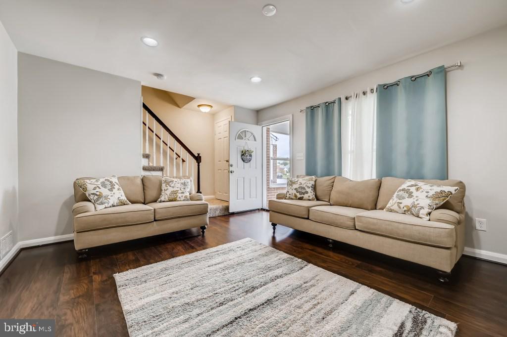 8023 Wallace Road Baltimore, MD 21222 - Photo 6 of 21 a living room with furniture and a couch