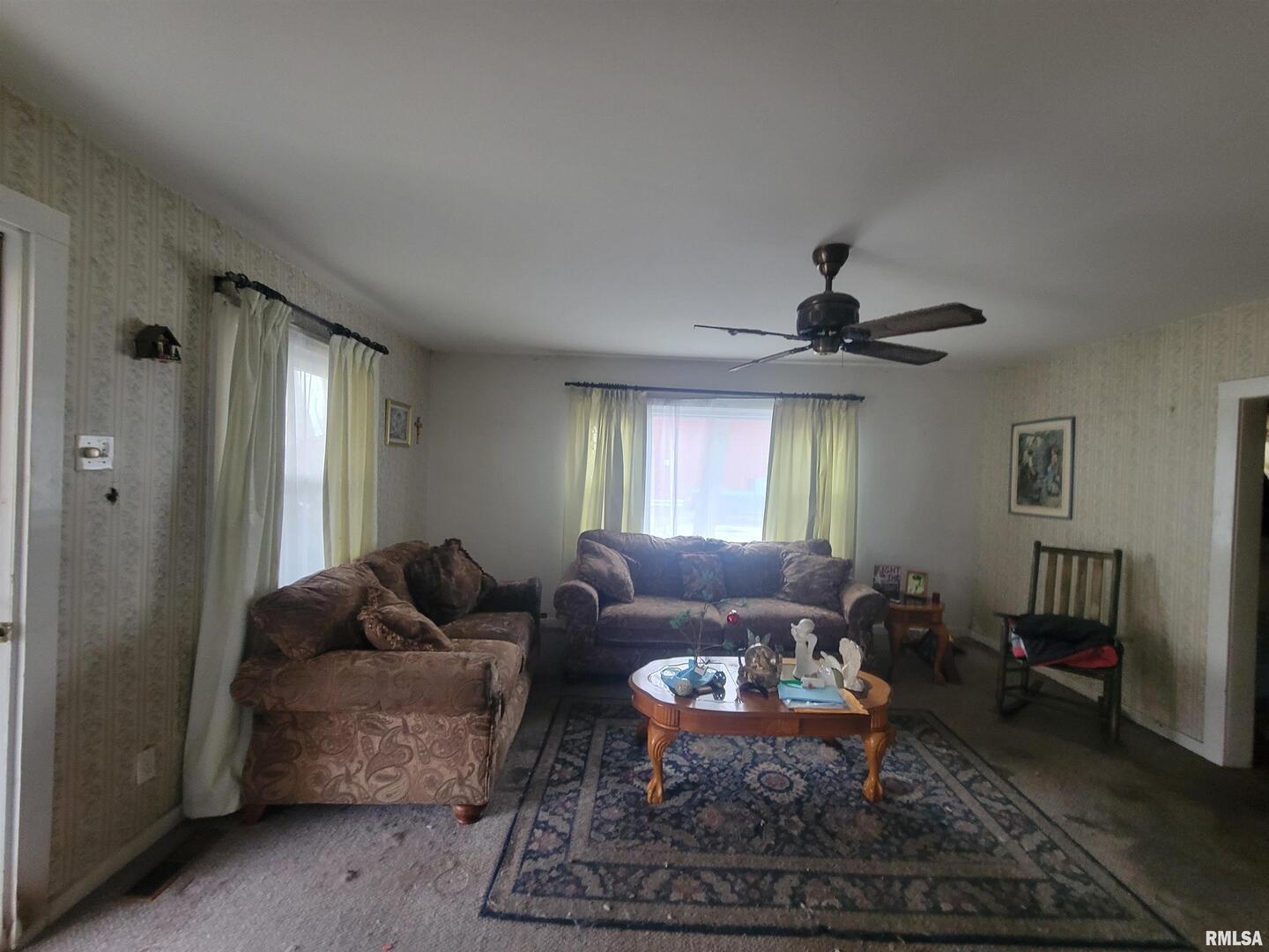 905 West Monroe Street Herrin, IL 62948 - Photo 6 of 14 a living room with furniture and a window