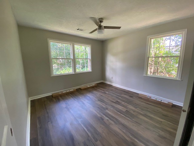 2802 King Street Columbus, GA 31906 - Photo 5 of 11 a view of an empty room with wooden floor and a window