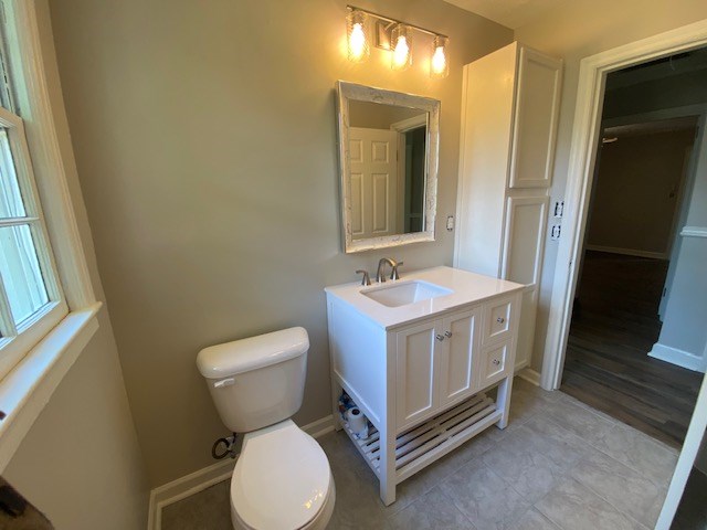2802 King Street Columbus, GA 31906 - Photo 8 of 11 a bathroom with a sink and a mirror