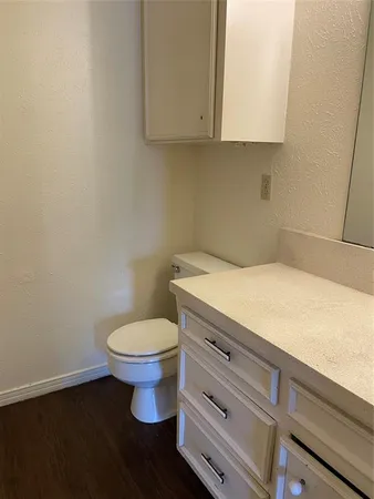a bathroom with a toilet and a sink