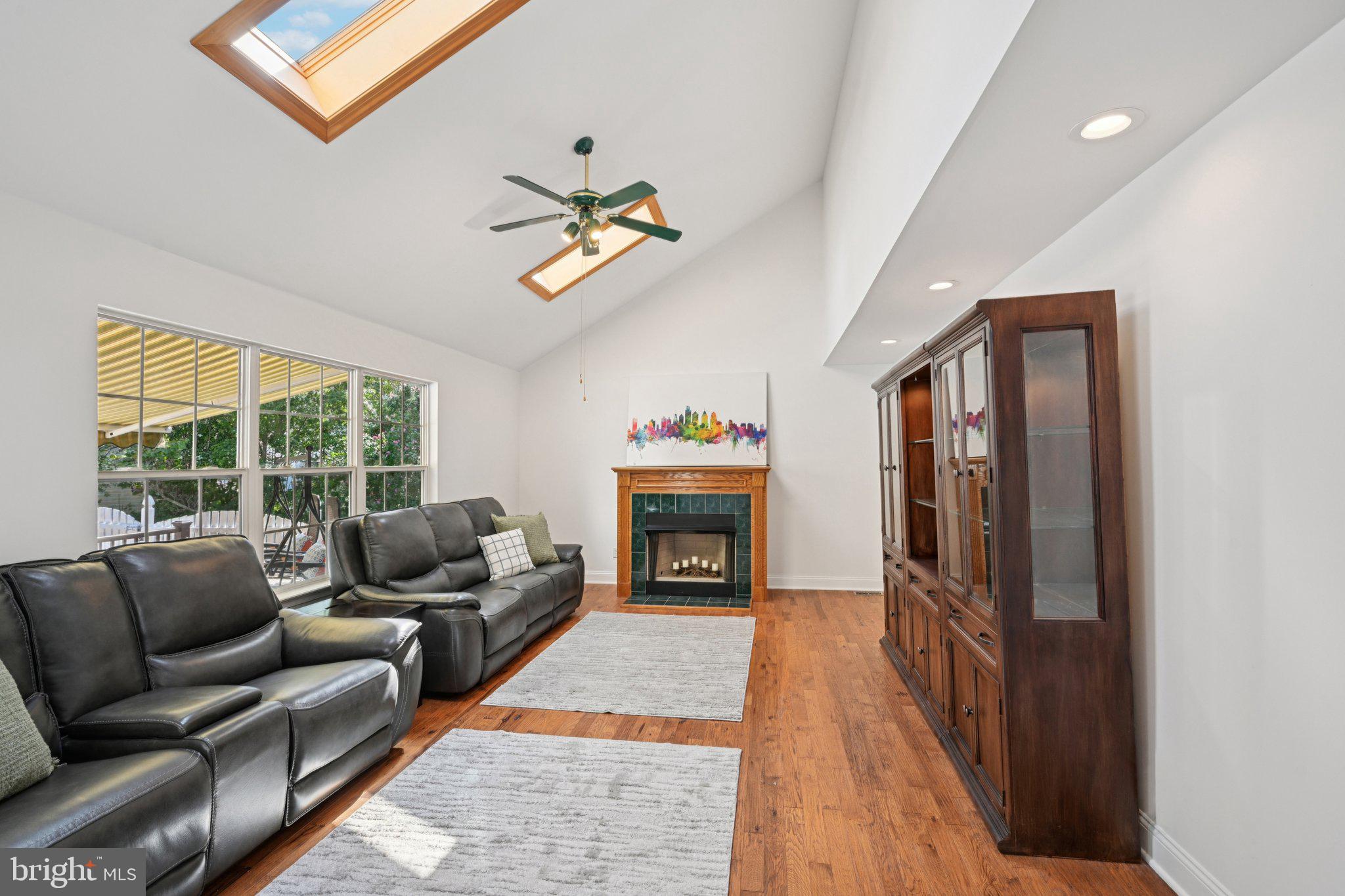 821 West Orvilla Road Hatfield, PA 19440 - Photo 11 of 64 a living room with furniture a fireplace and a large window