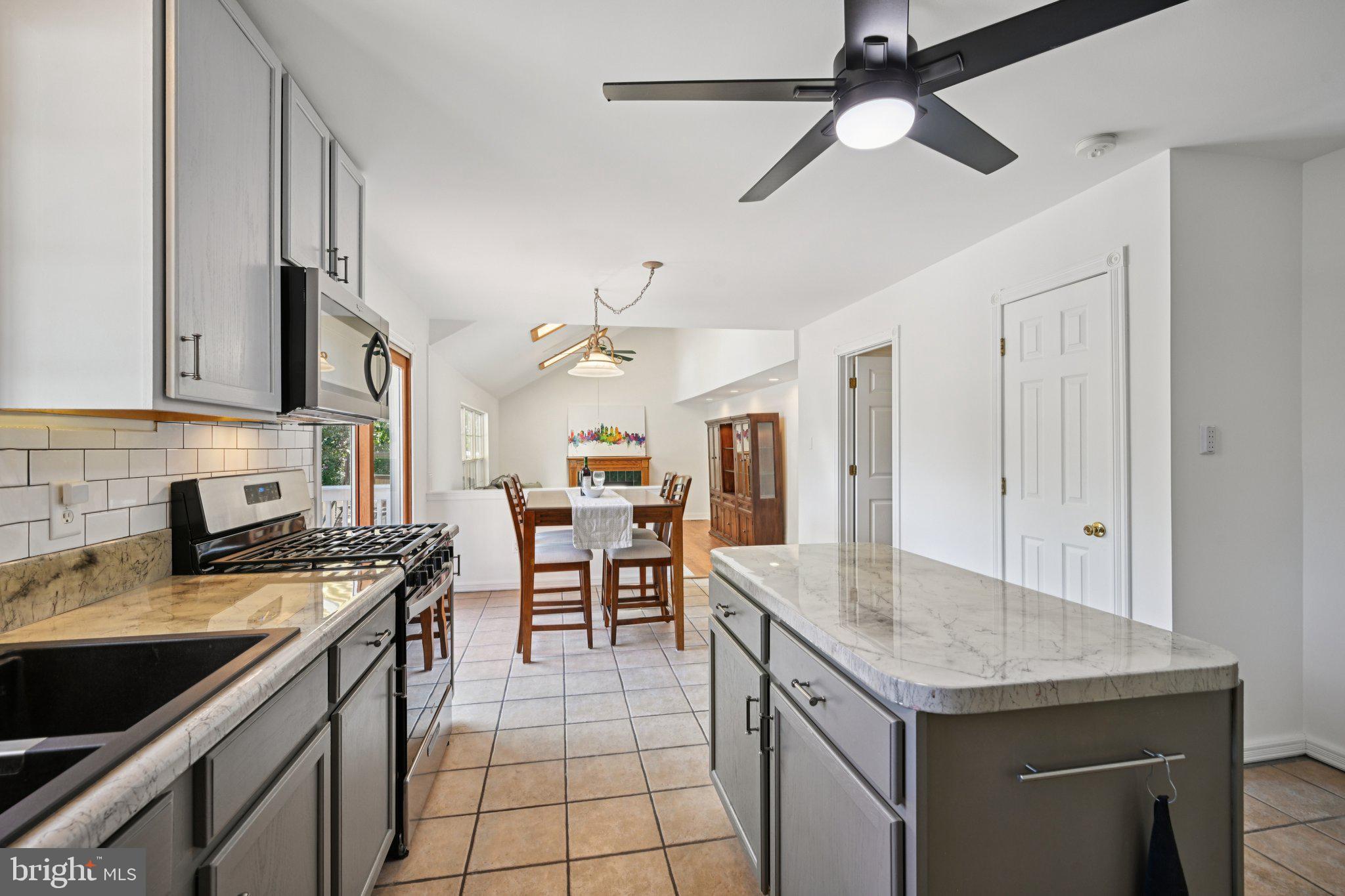 821 West Orvilla Road Hatfield, PA 19440 - Photo 19 of 64 a kitchen with stainless steel appliances granite countertop a sink a stove and a refrigerator