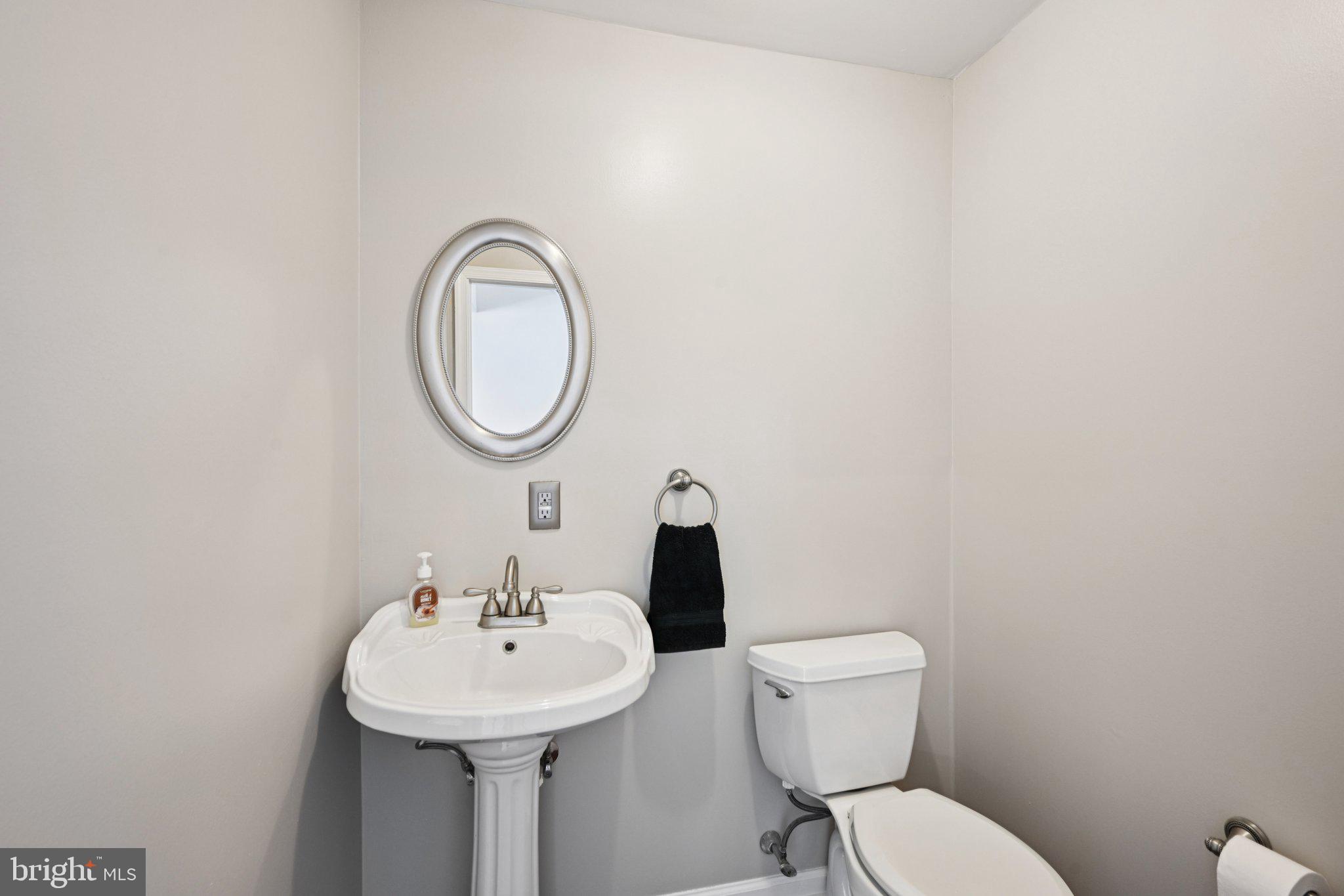 821 West Orvilla Road Hatfield, PA 19440 - Photo 24 of 64 a bathroom with a toilet a sink and a mirror