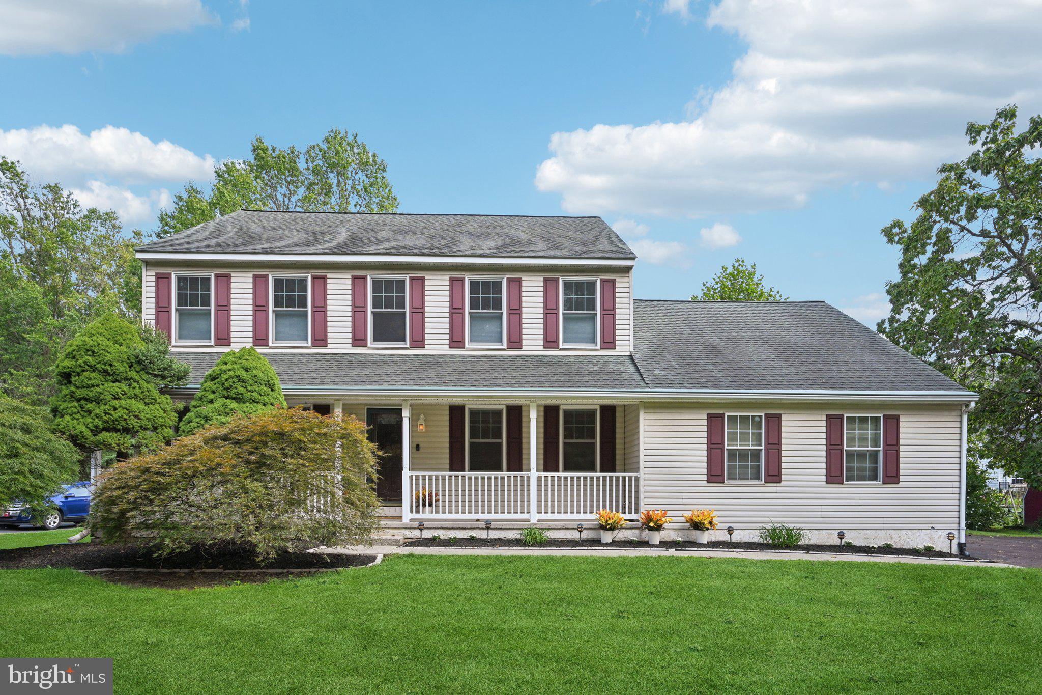 821 West Orvilla Road Hatfield, PA 19440 - Photo 3 of 64 a front view of a house with a yard and outdoor seating