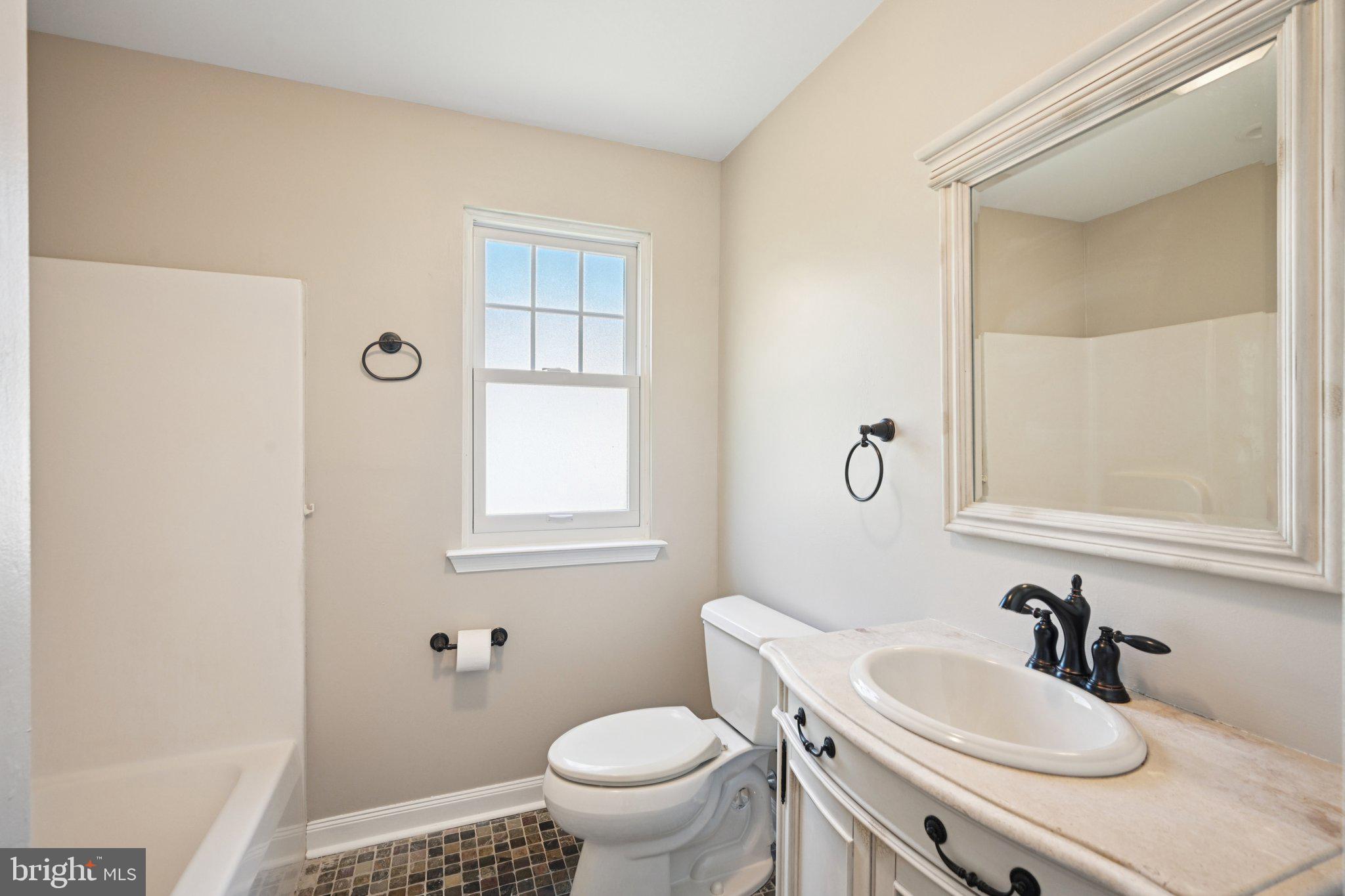 821 West Orvilla Road Hatfield, PA 19440 - Photo 33 of 64 a bathroom with a sink a toilet and a mirror