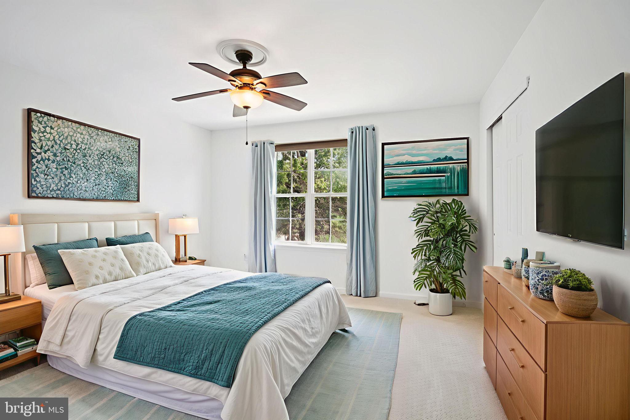 821 West Orvilla Road Hatfield, PA 19440 - Photo 35 of 64 a bedroom with a bed and a flat screen tv