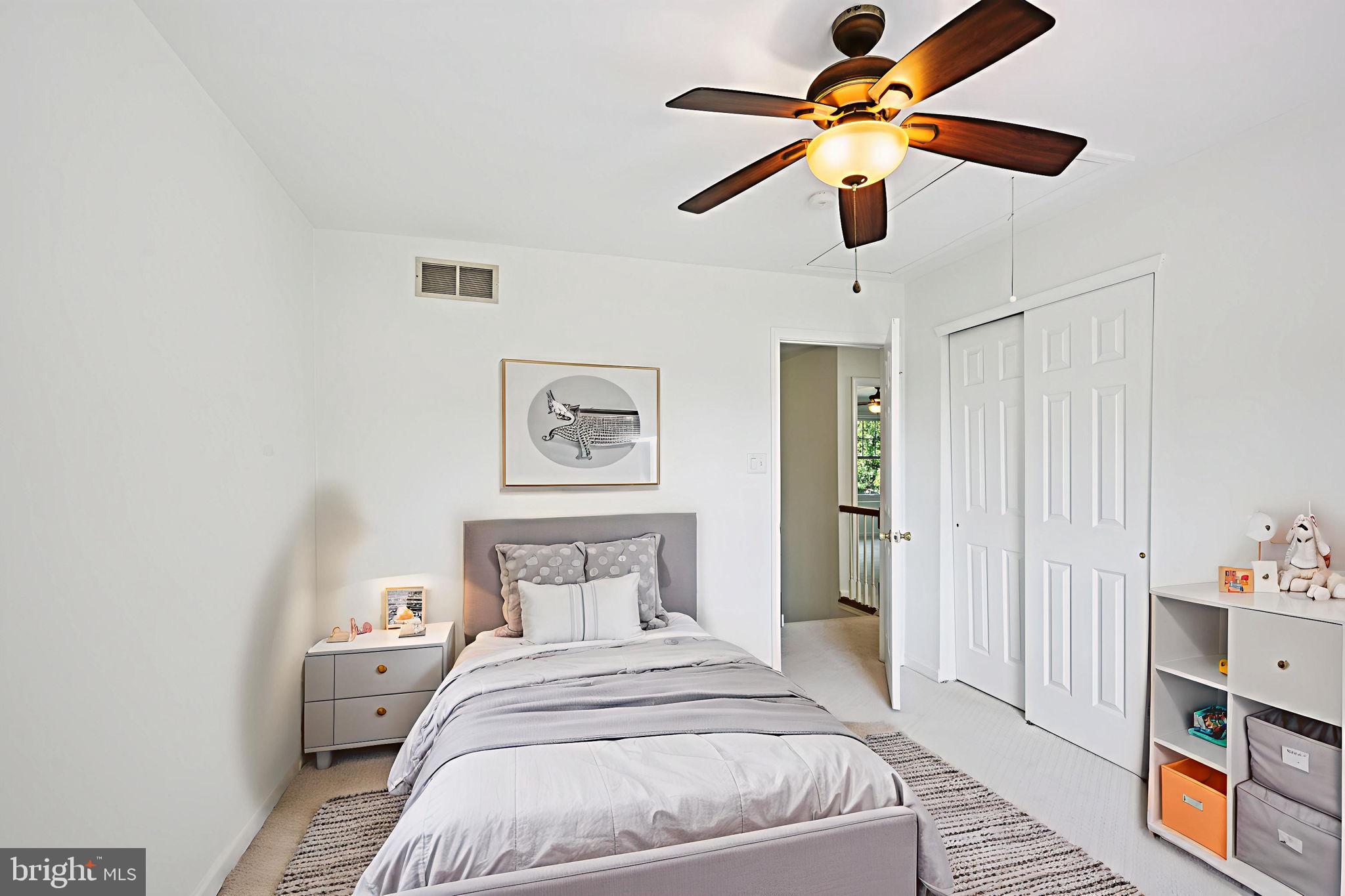 821 West Orvilla Road Hatfield, PA 19440 - Photo 36 of 64 a bedroom with a bed and a chandelier