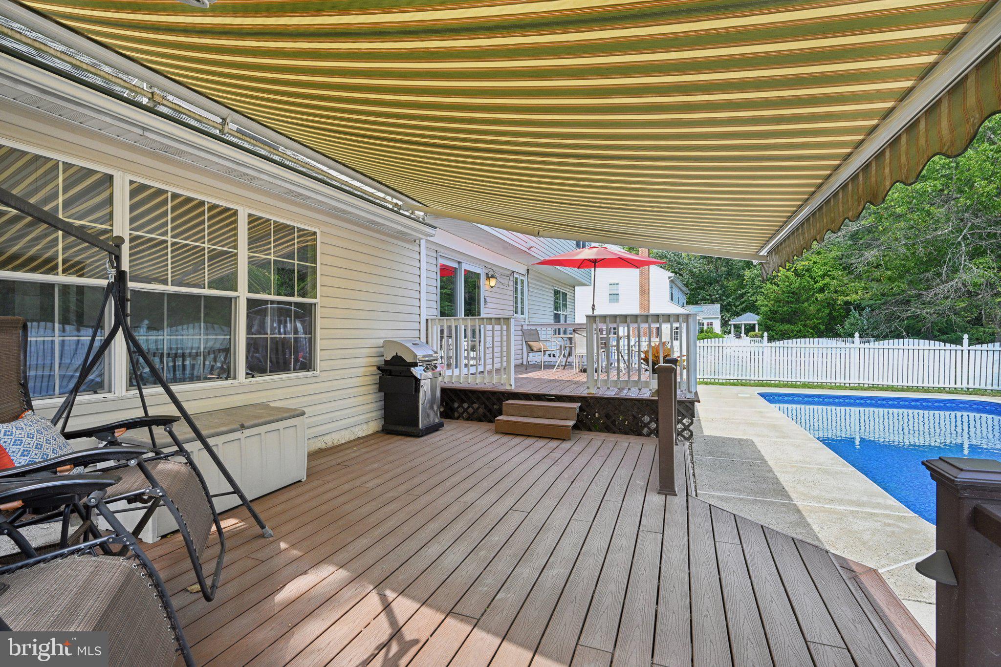 821 West Orvilla Road Hatfield, PA 19440 - Photo 42 of 64 a view of a patio with table and chairs with wooden floor and fence