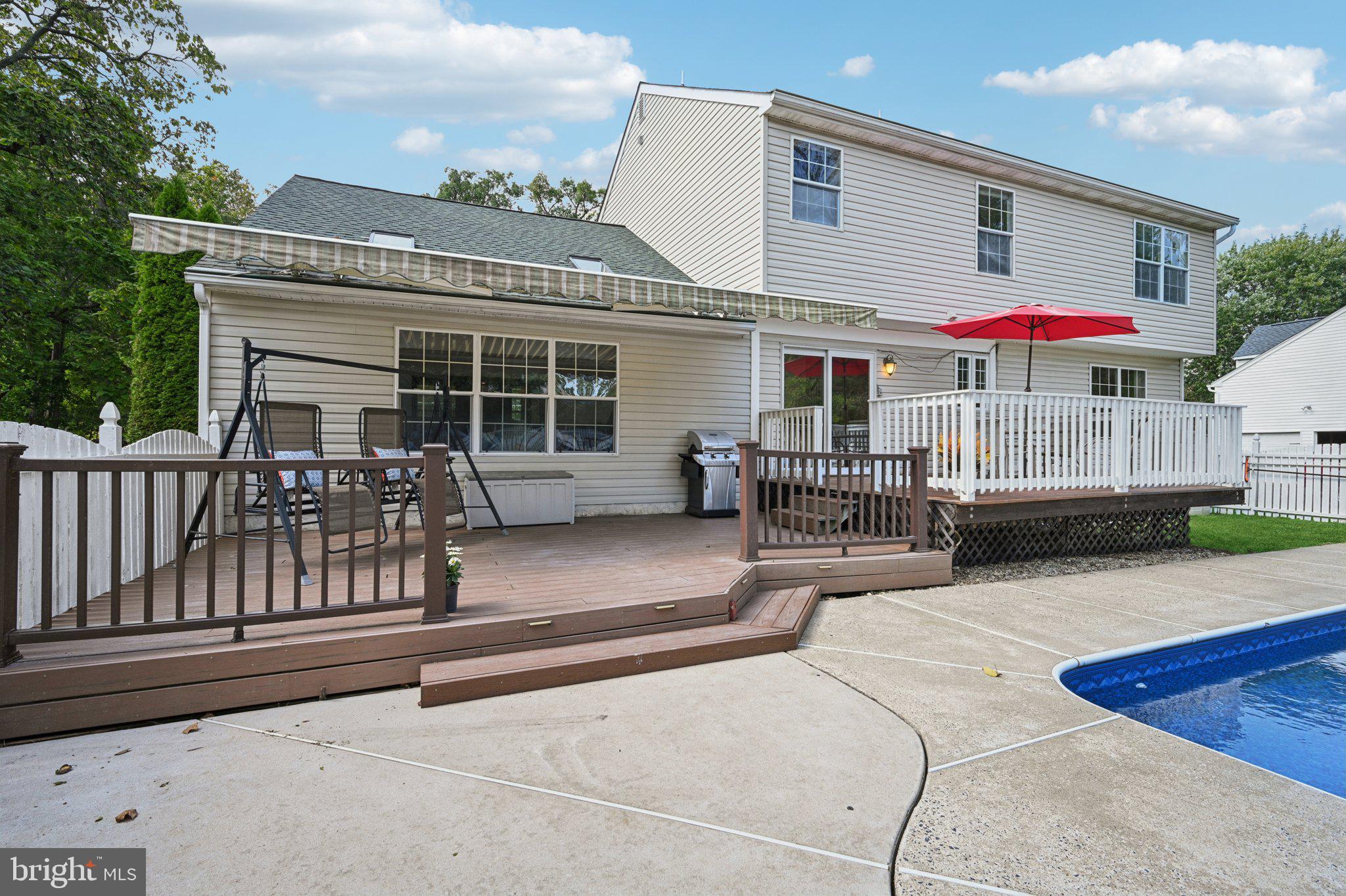 821 West Orvilla Road Hatfield, PA 19440 - Photo 43 of 64 a view of a house with a patio and a yard