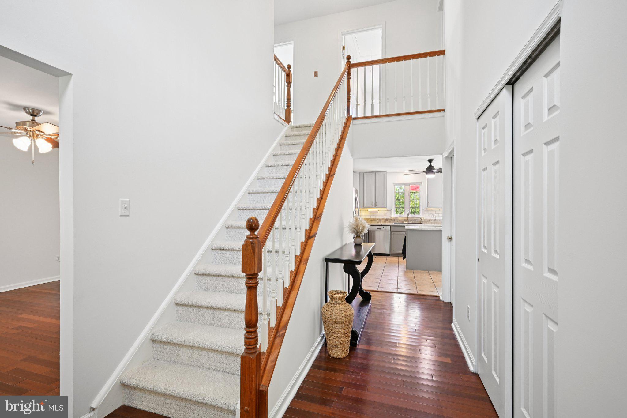 821 West Orvilla Road Hatfield, PA 19440 - Photo 9 of 64 a view of staircase with lots of frames on wall and wooden floor