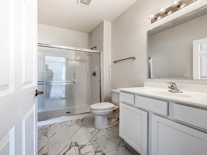 462 Ridge Lane Bolingbrook, IL 60440 - Photo 11 of 16 a bathroom with a sink toilet and shower
