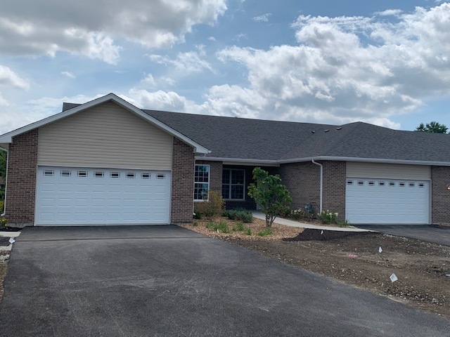 462 Ridge Lane Bolingbrook, IL 60440 - Photo 15 of 16 a front view of a house with a yard and garage
