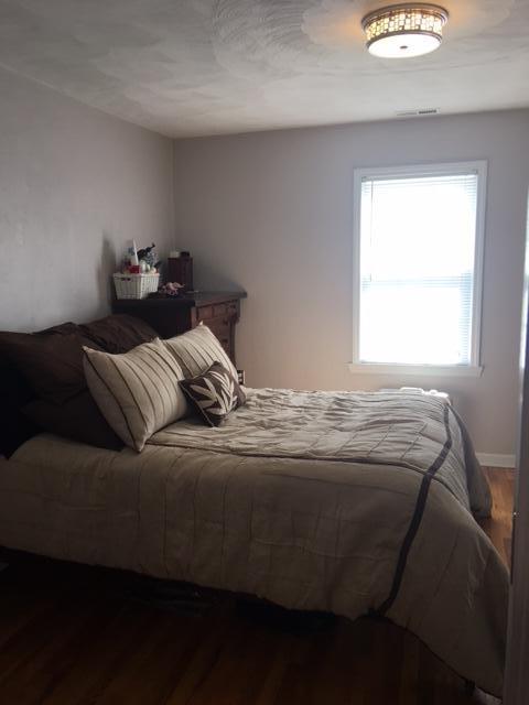1756 Goodview Road Goodview, VA 24095 - Photo 9 of 10 a bedroom with a bed and window