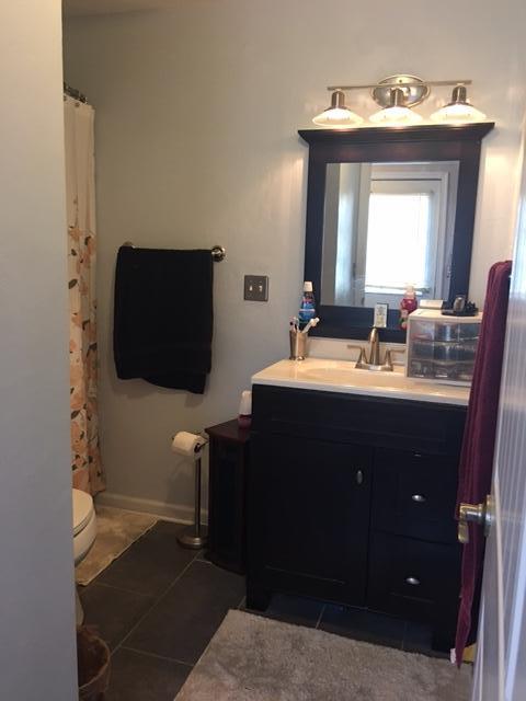 1756 Goodview Road Goodview, VA 24095 - Photo 10 of 10 a bathroom with a double vanity sink and a mirror