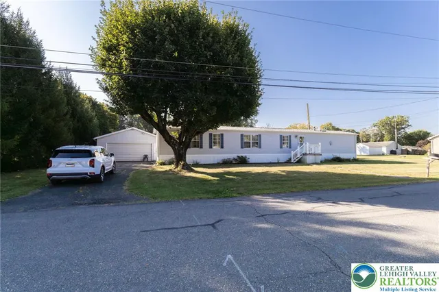 a view of yard with car parked