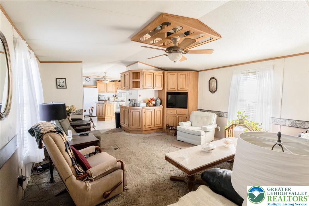 554 Norman Road Nazareth, PA 18064 - Photo 12 of 20 a living room with furniture a fireplace and a large window