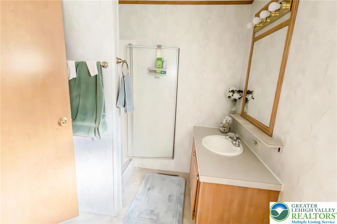 554 Norman Road Nazareth, PA 18064 - Photo 18 of 20 a bathroom with a sink and a mirror