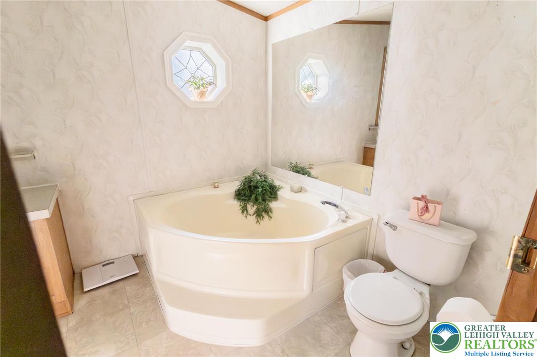 554 Norman Road Nazareth, PA 18064 - Photo 19 of 20 a white toilet sitting next to a white tub