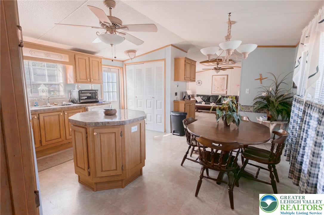 554 Norman Road Nazareth, PA 18064 - Photo 9 of 20 a dining table with chairs and chandelier