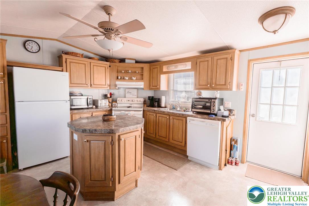 554 Norman Road Nazareth, PA 18064 - Photo 10 of 20 a kitchen with refrigerator cabinets and a window