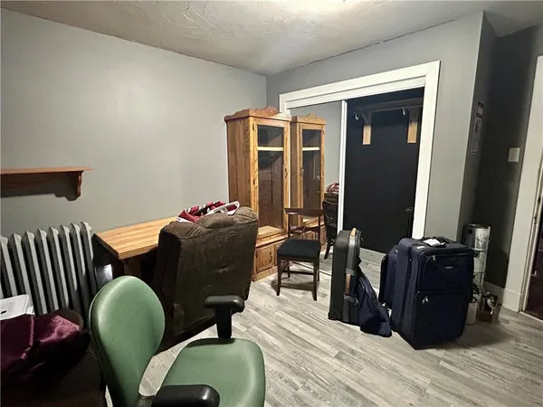 a living room with furniture rug and wooden floor