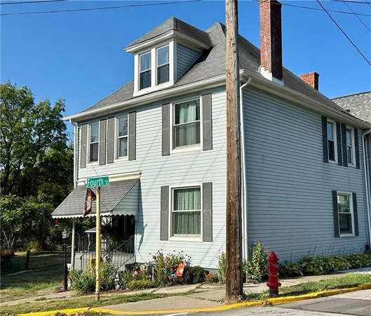 a front view of a house with street