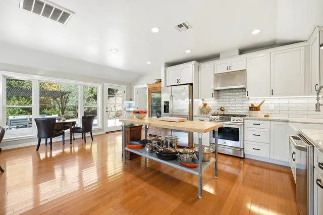 a view of a livingroom with furniture hardwood floor and a living room