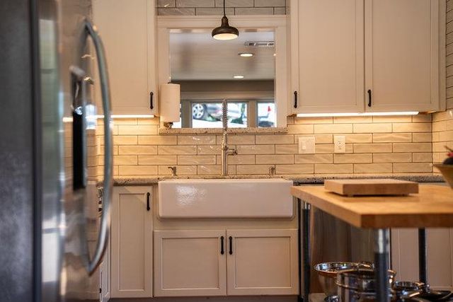 a view of a backyard with sitting area