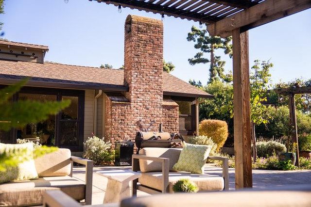 an aerial view of a house with a yard