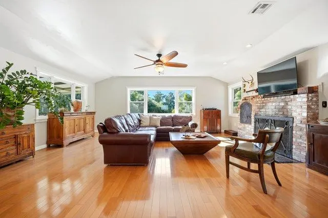 a large white kitchen with a large window