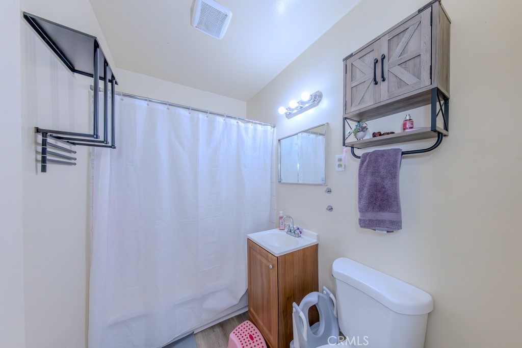 902 South Fann Street Anaheim, CA 92804 - Photo 11 of 31 a bathroom with a toilet and a shower