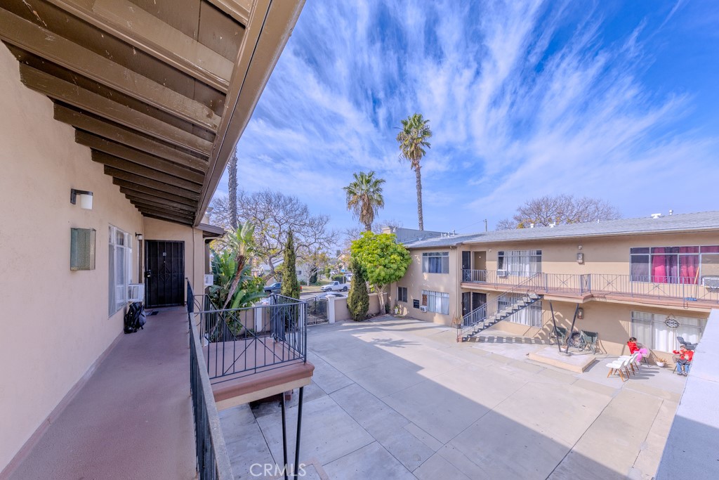 902 South Fann Street Anaheim, CA 92804 - Photo 16 of 31 a view of a patio with a table and chairs and potted plants