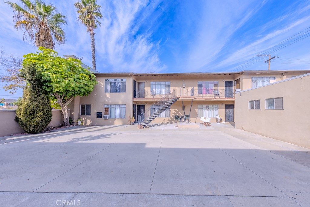 902 South Fann Street Anaheim, CA 92804 - Photo 3 of 31 a front view of a house with a yard and garage