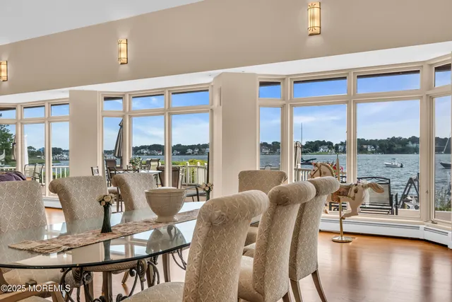 a bathroom with a sink mirror and a toilet