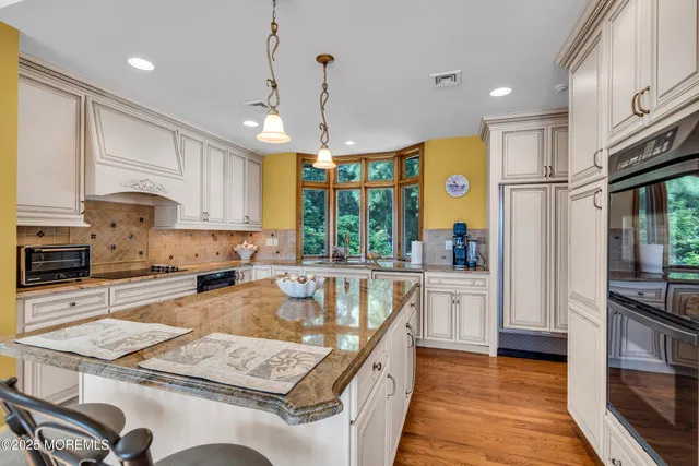 an aerial view of residential house with yard and swimming pool