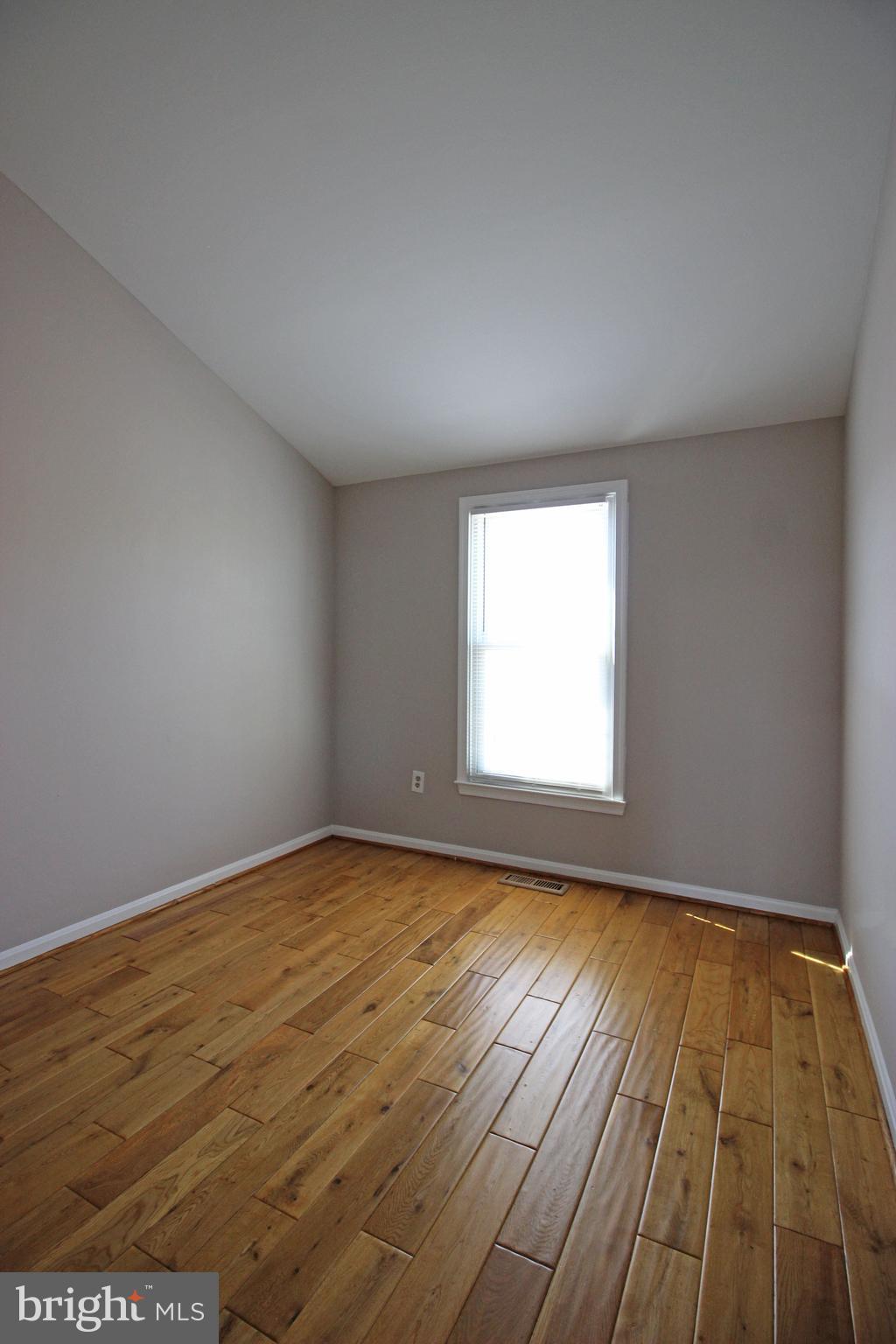 7609 Monitor Court Manassas, VA 20109 - Photo 18 of 32 an empty room with wooden floor and windows