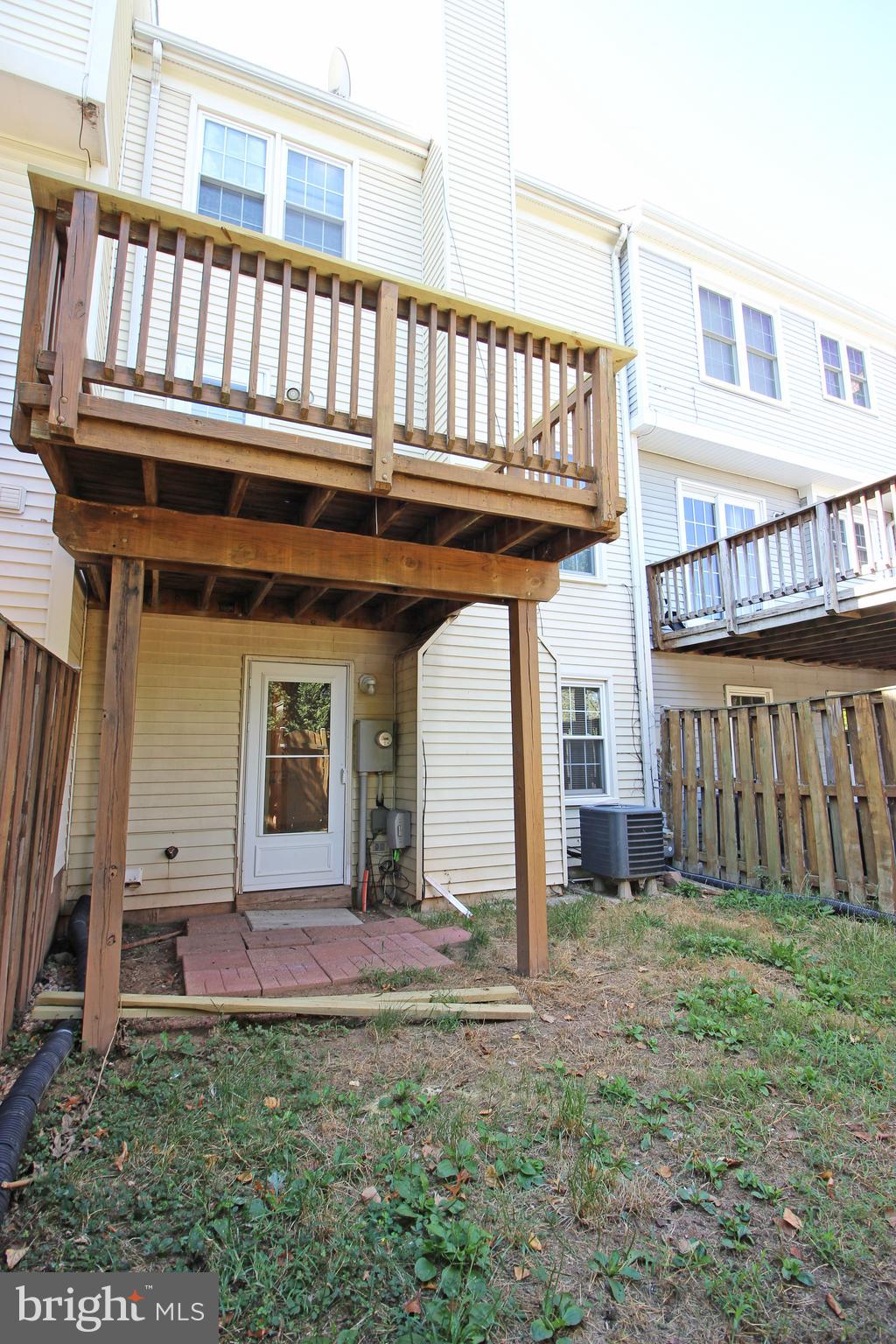 7609 Monitor Court Manassas, VA 20109 - Photo 26 of 32 a view of a house with backyard and deck